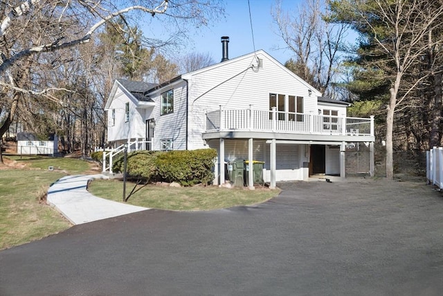 exterior space with a wooden deck and a garage