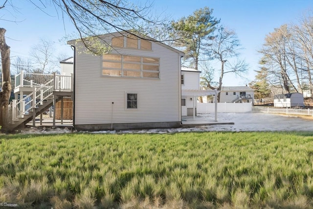 rear view of house with a yard and a patio area