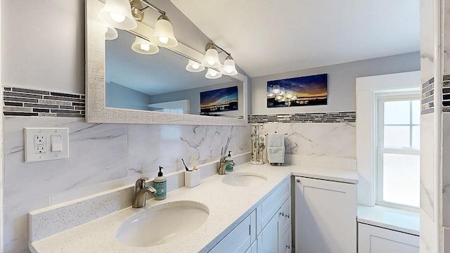 full bathroom with a sink, tile walls, and double vanity