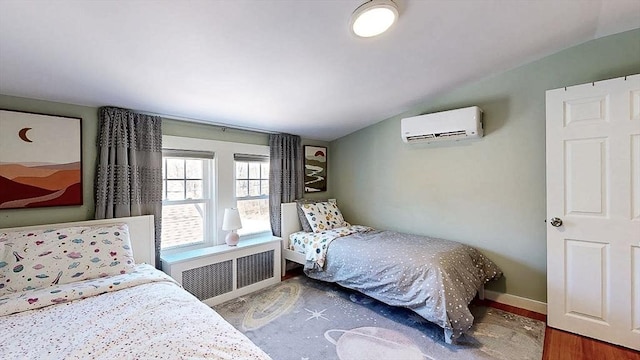 bedroom with radiator, baseboards, vaulted ceiling, and a wall mounted air conditioner