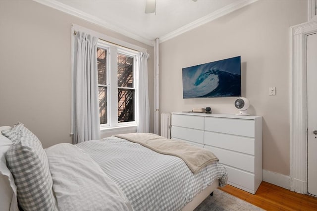 293-295 Commonwealth Ave Unit 3C, Boston, MA 02111 - bedroom with crown molding, light wood-style floors, baseboards, and ceiling fan