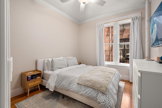 293-295 Commonwealth Ave Unit 3C, Boston, MA 02111 - bedroom with crown molding, wood finished floors, baseboards, and ceiling fan