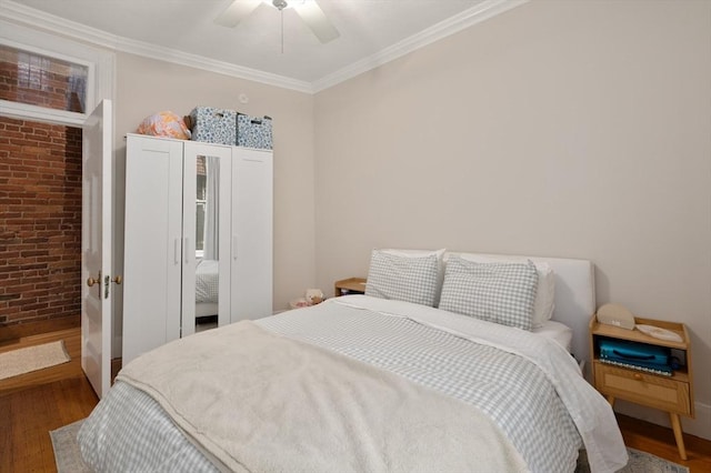 293-295 Commonwealth Ave Unit 3C, Boston, MA 02111 - bedroom featuring wood finished floors, crown molding, brick wall, and a ceiling fan