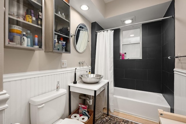 293-295 Commonwealth Ave Unit 3C, Boston, MA 02111 - full bath featuring toilet, a wainscoted wall, vanity, and shower / tub combo