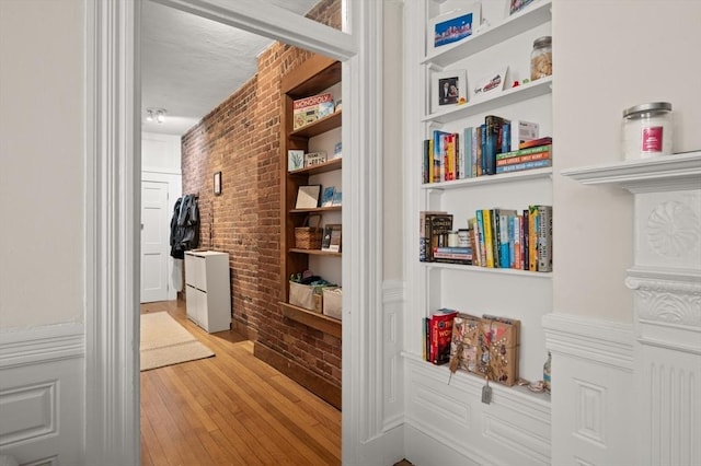 293-295 Commonwealth Ave Unit 3C, Boston, MA 02111 - hall with brick wall, light wood finished floors, and built in features
