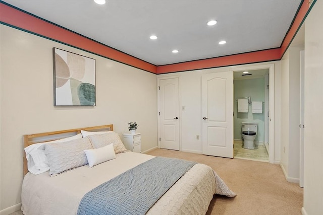 bedroom featuring connected bathroom, recessed lighting, light colored carpet, and baseboards