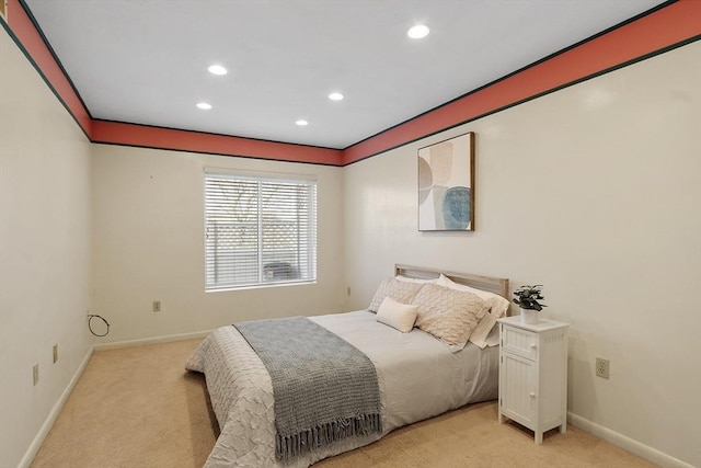 bedroom with recessed lighting, light carpet, and baseboards