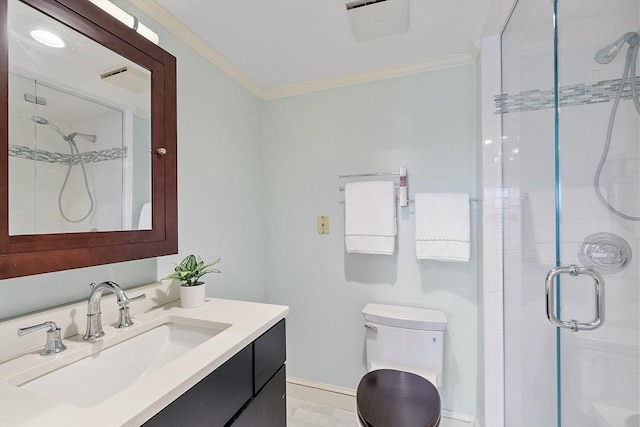 bathroom with crown molding, toilet, a shower stall, and vanity