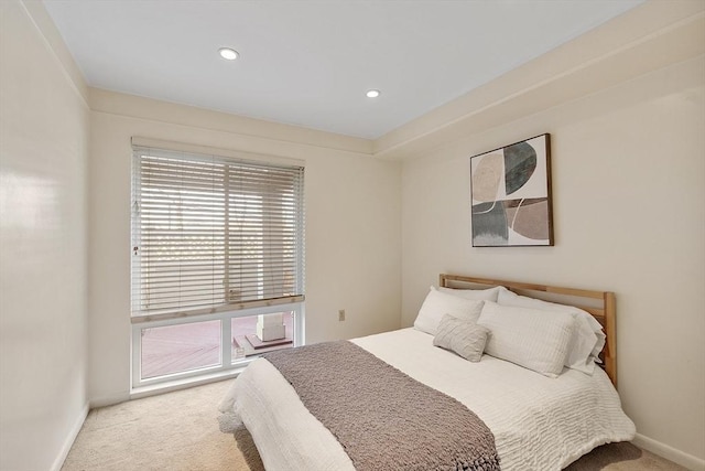 bedroom with baseboards, recessed lighting, and carpet flooring