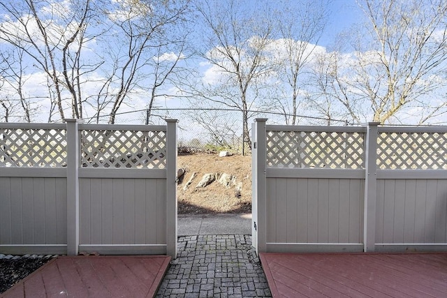 view of gate with fence