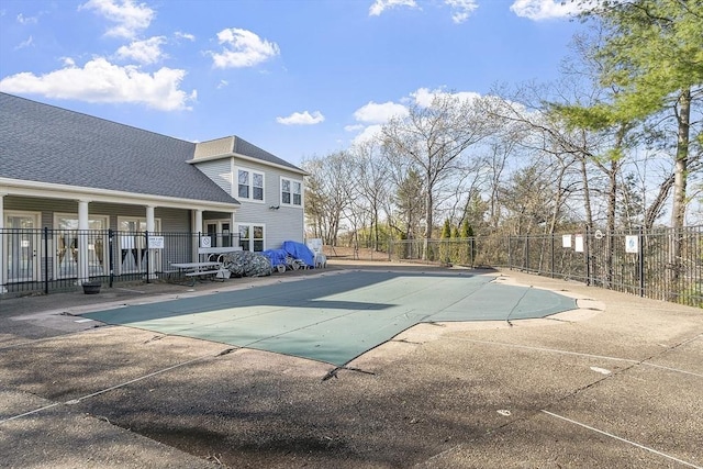 pool featuring a patio and fence