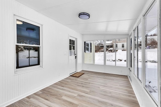 unfurnished sunroom featuring a healthy amount of sunlight