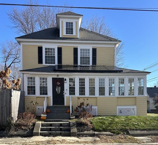 view of front of home featuring entry steps and fence