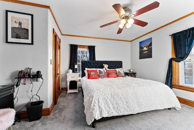 bedroom with crown molding, baseboards, and carpet floors