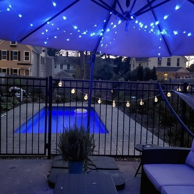 view of pool with a fenced in pool, a patio, and fence