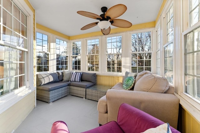 sunroom with a ceiling fan