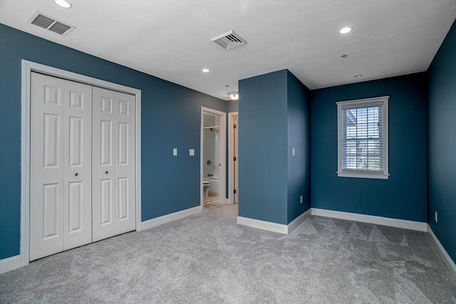 unfurnished bedroom with recessed lighting, baseboards, visible vents, and carpet floors