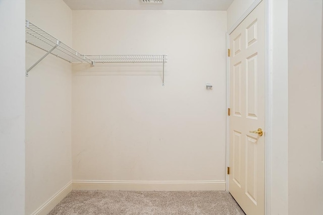 spacious closet with visible vents and carpet