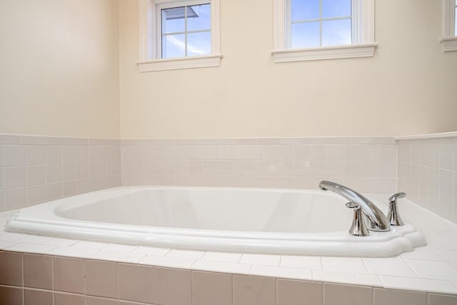 bathroom with a garden tub