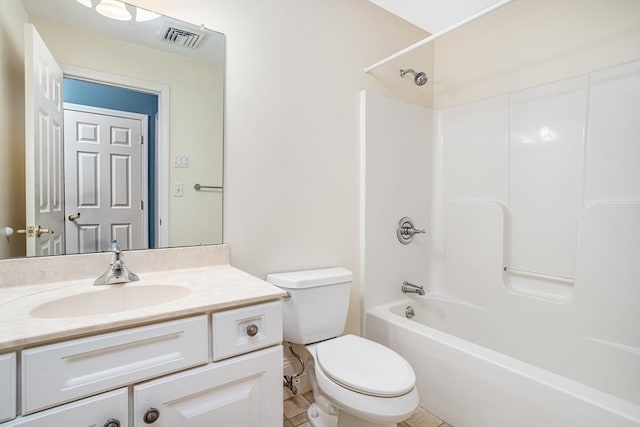 bathroom featuring visible vents, toilet, vanity, and tub / shower combination