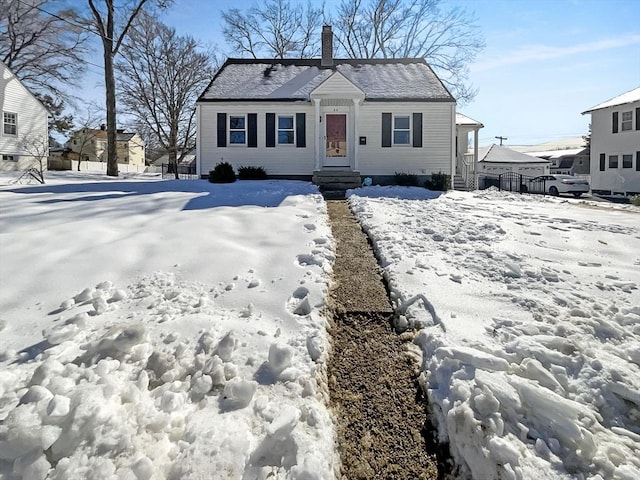 bungalow-style house featuring a chimney