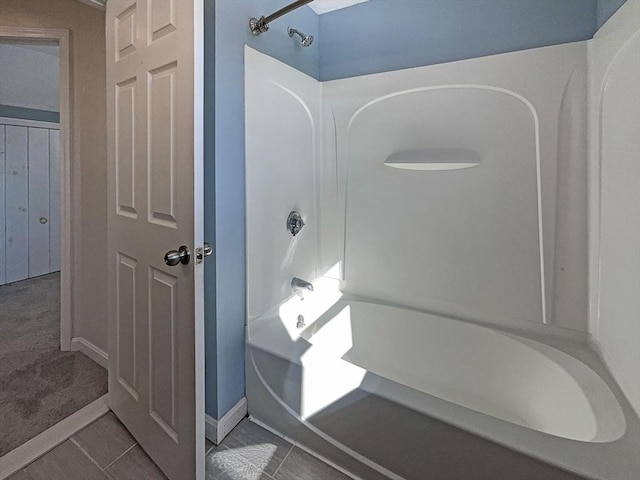 bathroom featuring shower / bathing tub combination and tile patterned floors