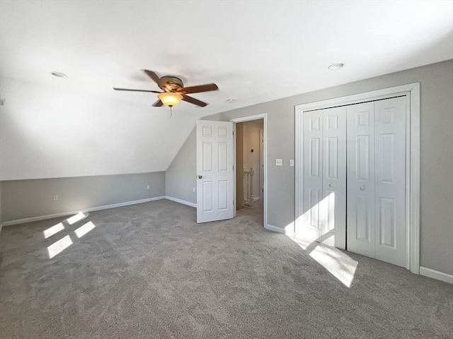 additional living space featuring ceiling fan, carpet, baseboards, and vaulted ceiling