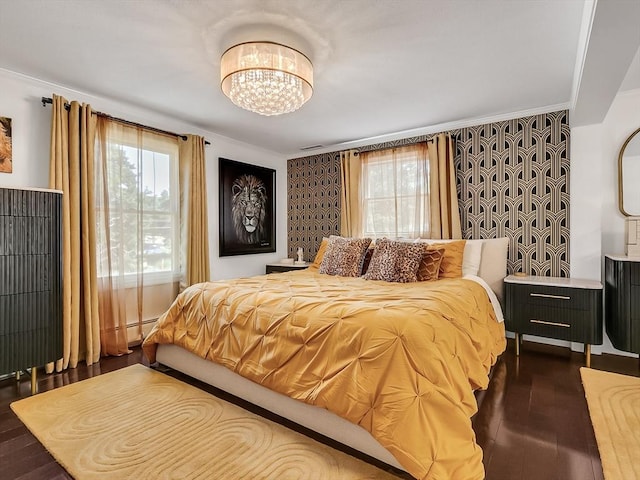 188 Atlantic St, Gloucester, MA 01930 - bedroom with a chandelier, dark wood-style flooring, crown molding, and a baseboard radiator