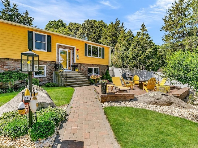 188 Atlantic St, Gloucester, MA 01930 - bi-level home with brick siding and a patio