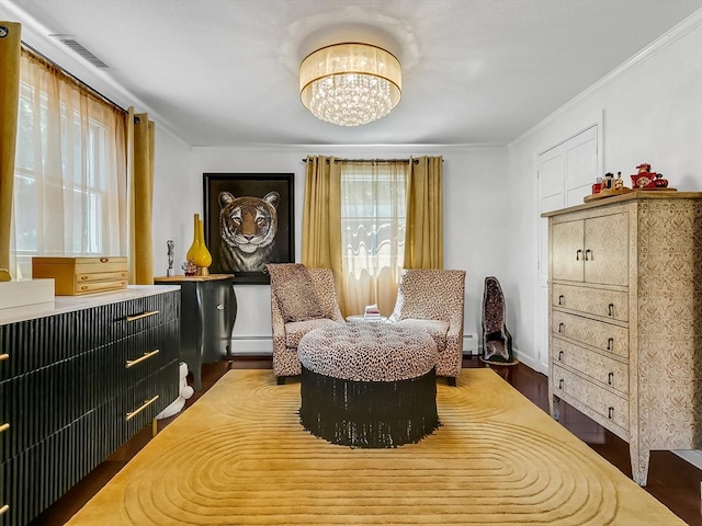 188 Atlantic St, Gloucester, MA 01930 - sitting room with a baseboard radiator, crown molding, a chandelier, and wood finished floors