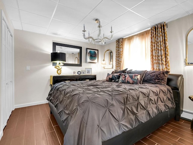 188 Atlantic St, Gloucester, MA 01930 - bedroom with a paneled ceiling, wood tiled floors, and baseboard heating
