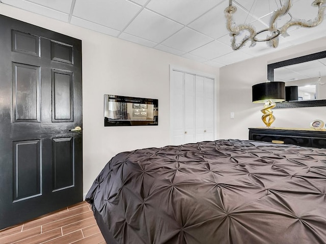 188 Atlantic St, Gloucester, MA 01930 - bedroom featuring a chandelier, wood finished floors, and a closet