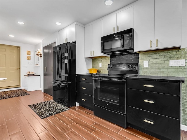 188 Atlantic St, Gloucester, MA 01930 - kitchen with black appliances, dark countertops, white cabinets, dark wood-style floors, and decorative backsplash