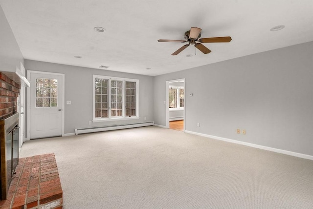 unfurnished living room featuring a brick fireplace, baseboards, and a baseboard radiator