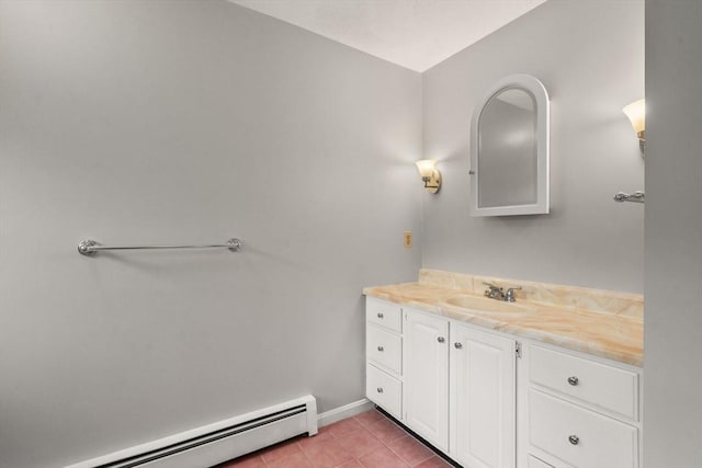 bathroom featuring vanity, tile patterned floors, baseboards, and a baseboard radiator