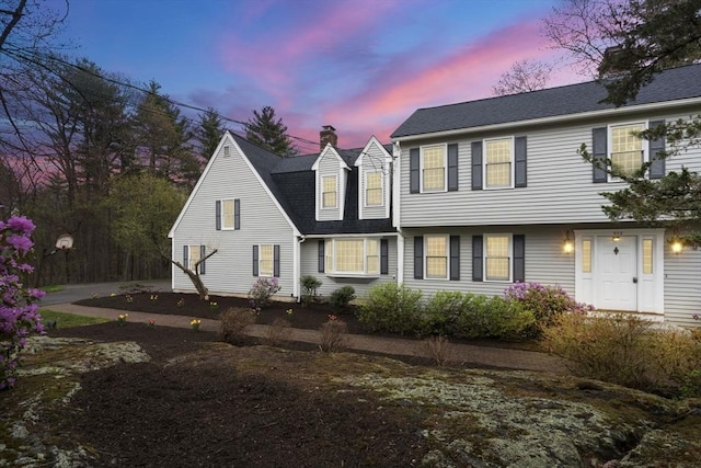 view of front of home with a chimney