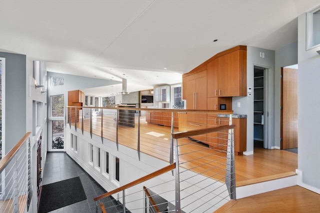 kitchen with lofted ceiling and dark wood finished floors