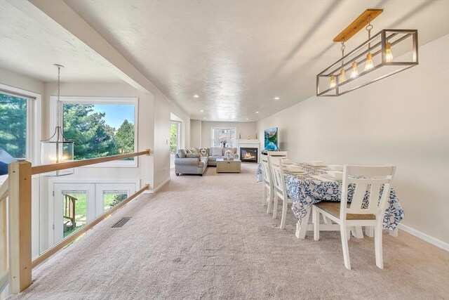 222 Algonquin Unit 222, Ashland, MA 01721 - carpeted dining room with baseboards, a glass covered fireplace, and recessed lighting