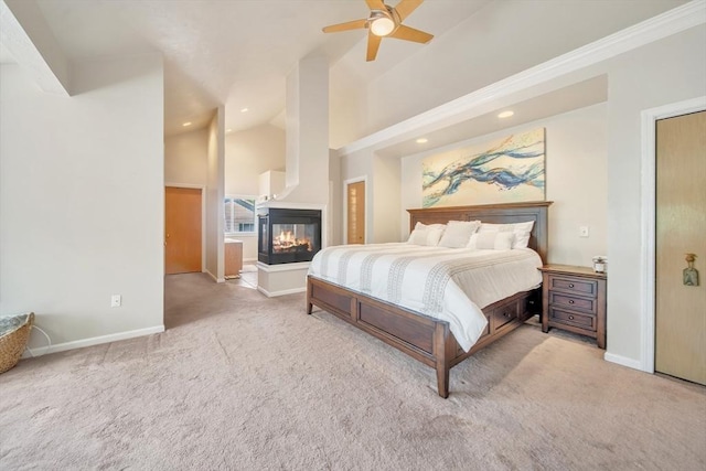 222 Algonquin Unit 222, Ashland, MA 01721 - carpeted bedroom with baseboards, a multi sided fireplace, recessed lighting, high vaulted ceiling, and a ceiling fan