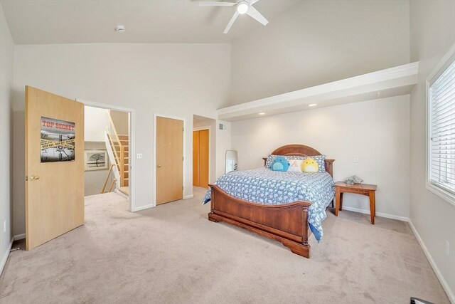 222 Algonquin Unit 222, Ashland, MA 01721 - bedroom featuring light carpet, high vaulted ceiling, baseboards, and ceiling fan