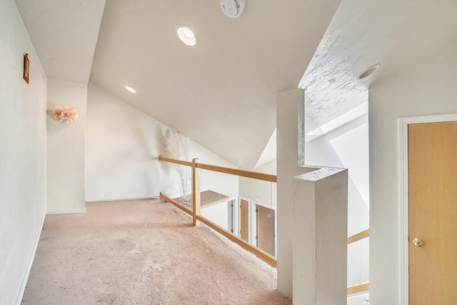 222 Algonquin Unit 222, Ashland, MA 01721 - hallway with lofted ceiling, carpet flooring, and an upstairs landing