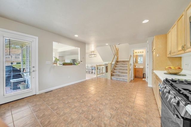 222 Algonquin Unit 222, Ashland, MA 01721 - kitchen featuring light brown cabinets, plenty of natural light, light tile patterned flooring, recessed lighting, and gas range