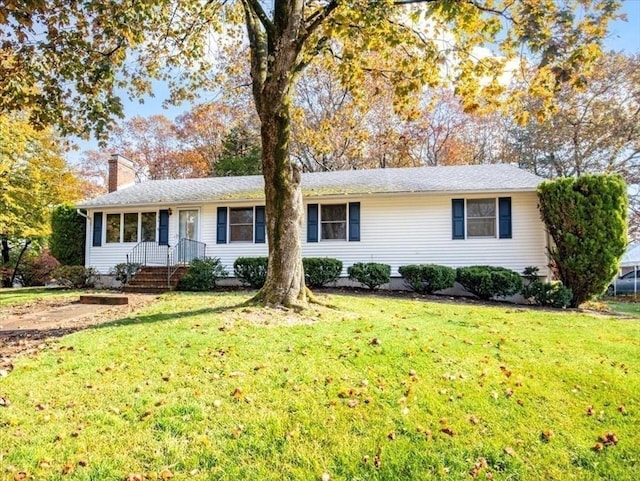 ranch-style home with a front yard