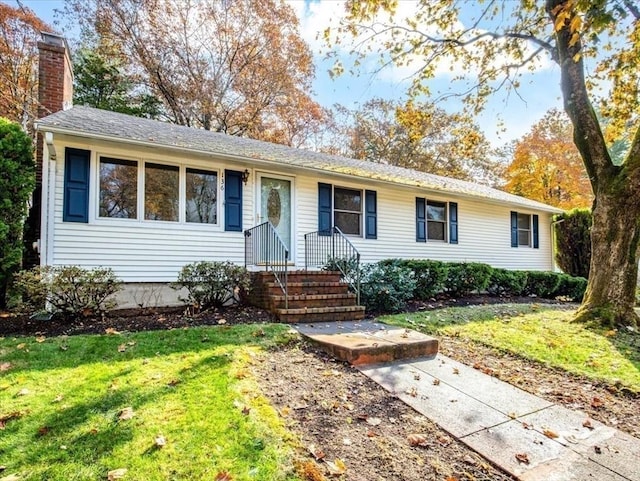 ranch-style house with a front yard