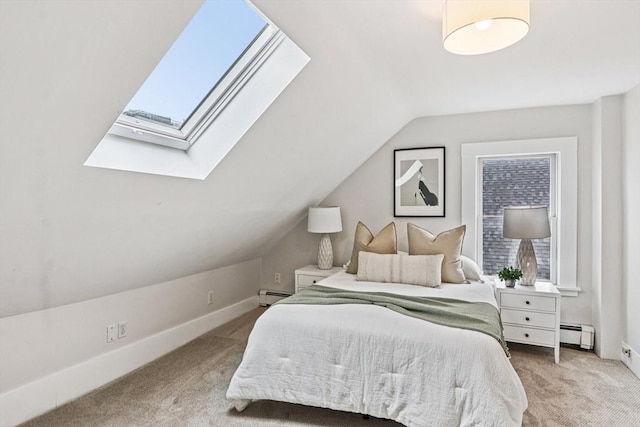 20 Lake St Unit 2, Somerville, MA 02143 - bedroom with a baseboard radiator, carpet, a skylight, lofted ceiling, and baseboards
