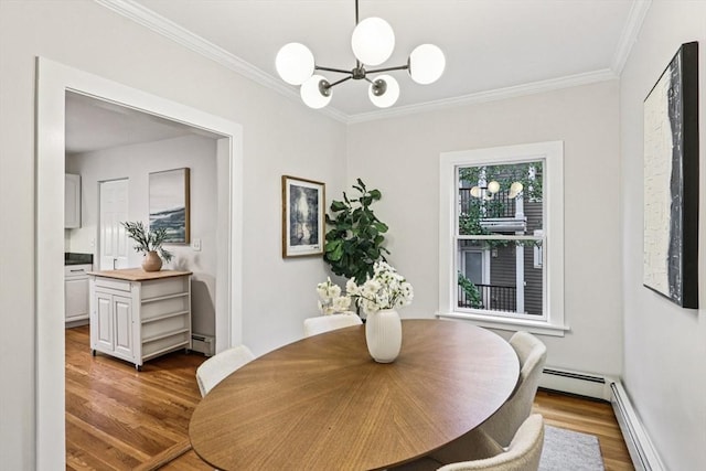 20 Lake St Unit 2, Somerville, MA 02143 - dining space with wood finished floors, ornamental molding, a chandelier, and baseboard heating