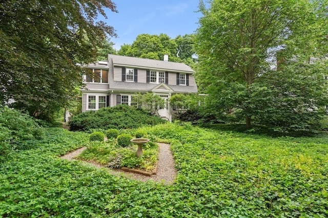 21 Marsh St, Dedham, MA 02026 - view of front of home with a chimney
