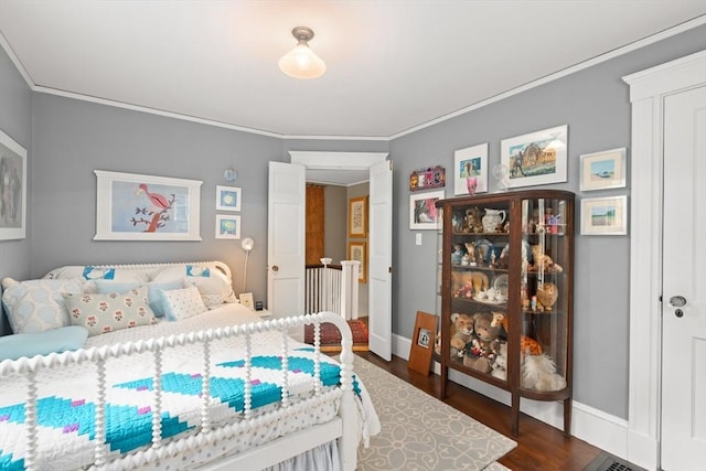 21 Marsh St, Dedham, MA 02026 - bedroom with ornamental molding and dark wood-style floors
