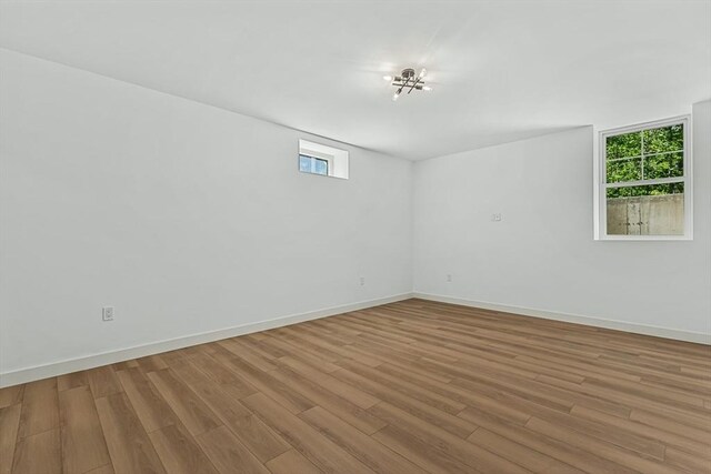 443 Central Ave, Needham, MA 02494 - spare room with wood finished floors and baseboards
