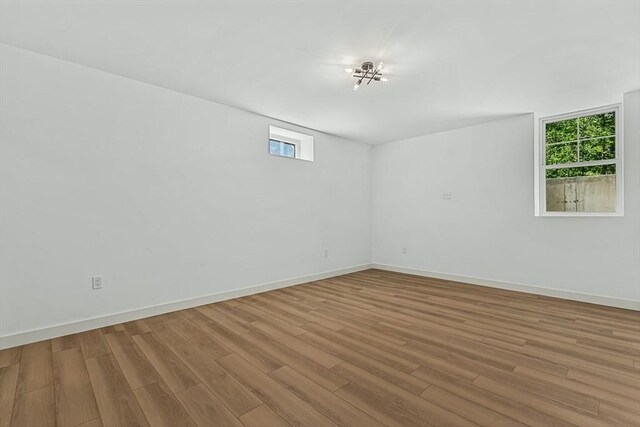 443 Central Ave, Needham, MA 02494 - unfurnished room with wood finished floors and baseboards
